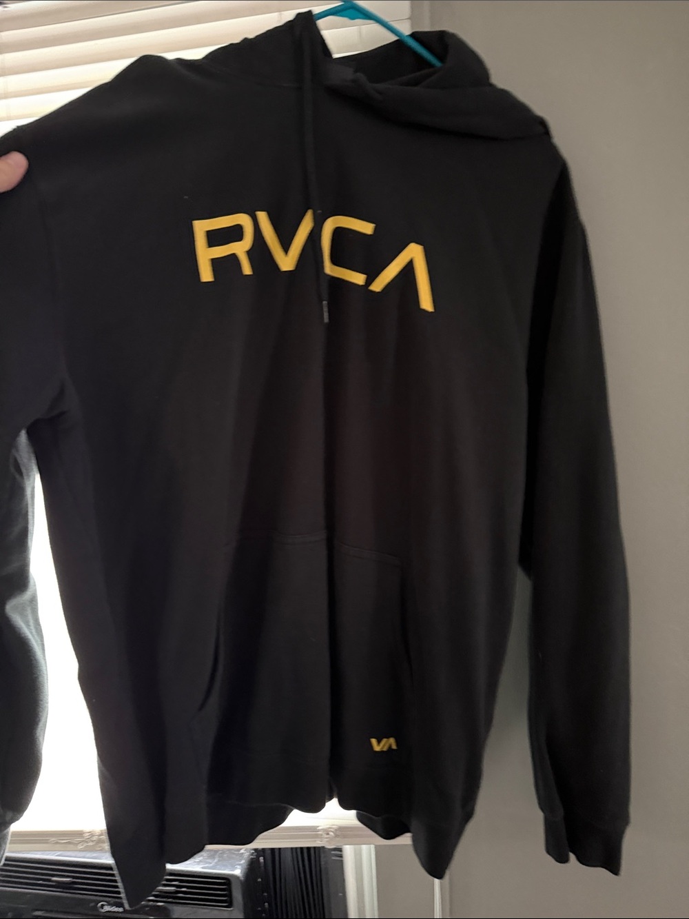 Hooded garment with RVCA label